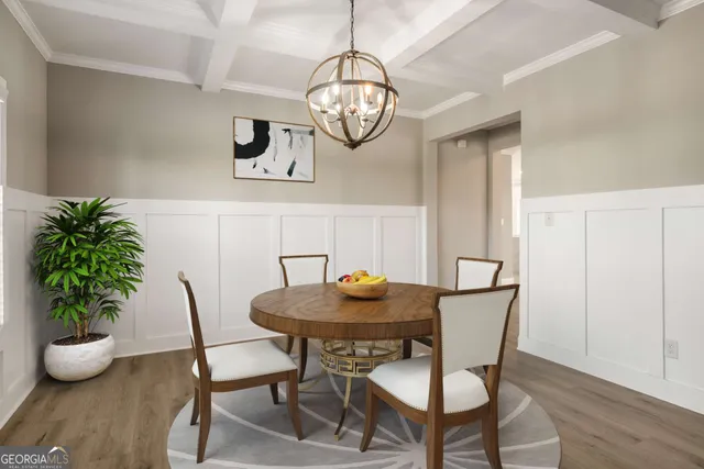 a view of a dining room with furniture wooden floor and chandelier