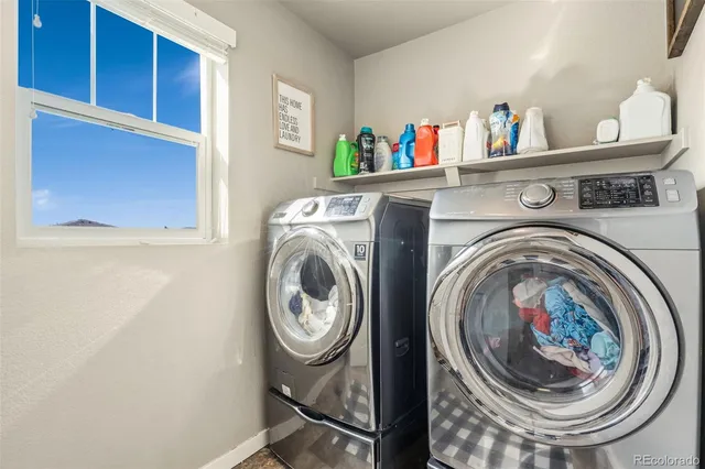 a bathroom with a sink mirror vanity and toilet