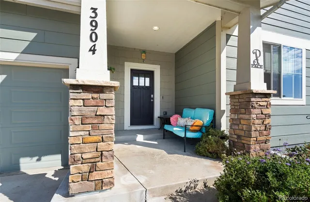 a backyard of a house with outdoor seating