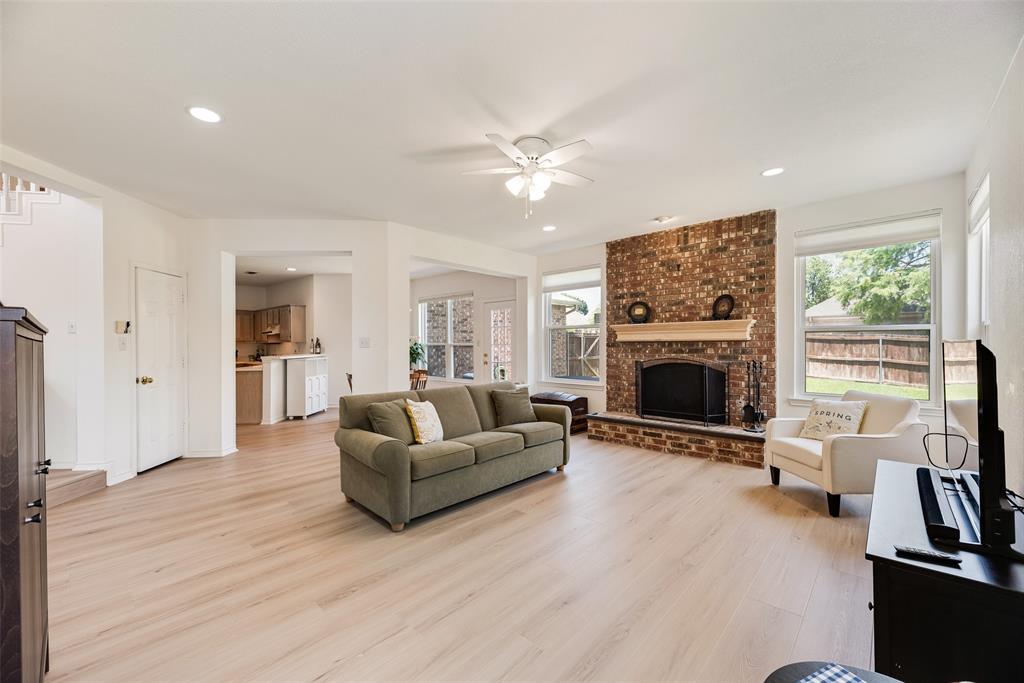 1406 West Peters Colony Road Carrollton, TX 75007 - Photo 21 of 29 a living room with furniture and a fireplace