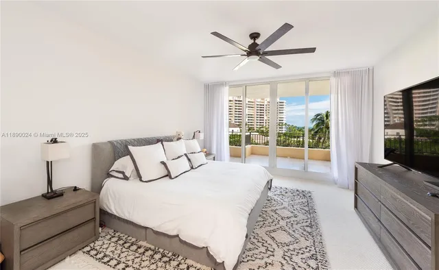 a living room with a flat screen tv and a large window