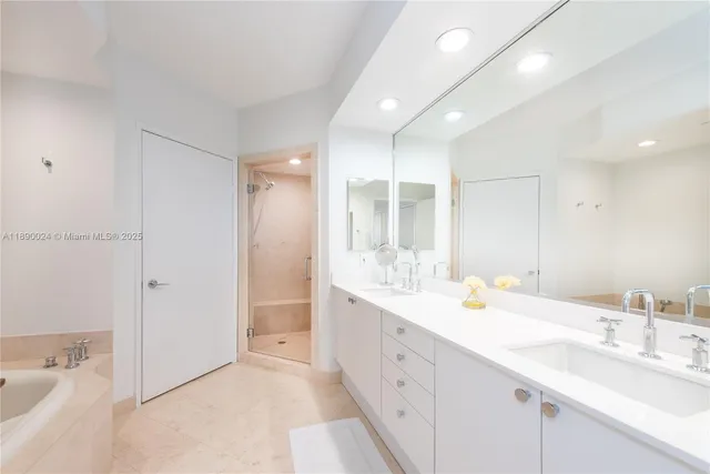 a white bath tub sitting in a bathroom
