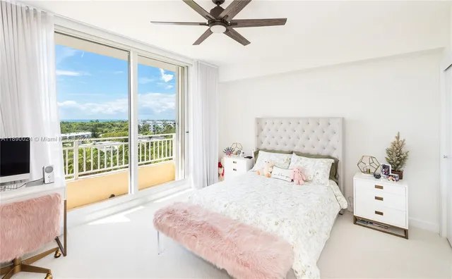 a bedroom with furniture and flat screen tv