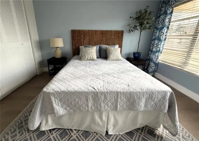 a bathroom with a double vanity sink mirror and toilet