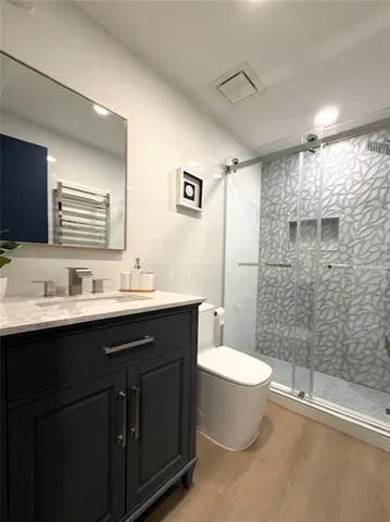 a view of a kitchen island with a sink and a potted plant