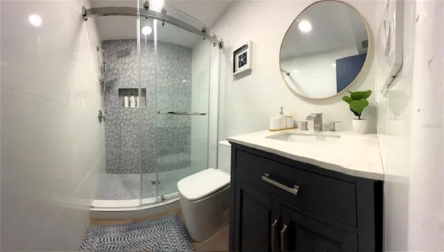 a bathroom with a shower and a toilet