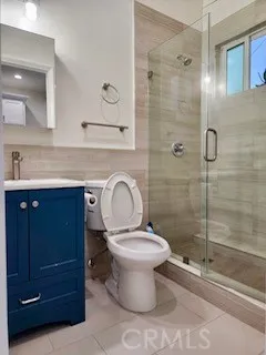 a bathroom with a toilet sink and a shower