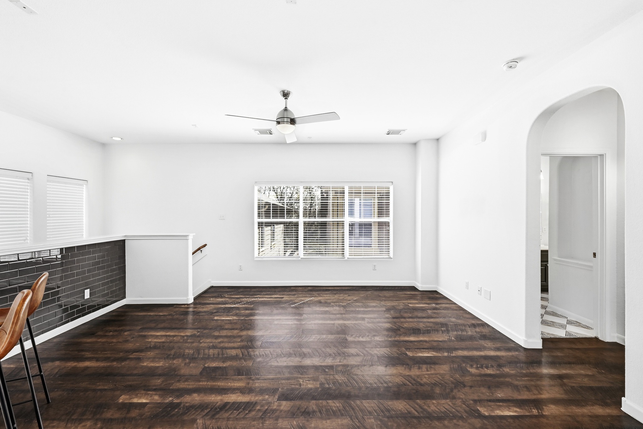 2821 Saville Loop, Unit 21C Austin, TX 78741 - Photo 13 of 31 Engineered wood flooring runs throughout the main living area, offering a consistent look that stands up to daily use