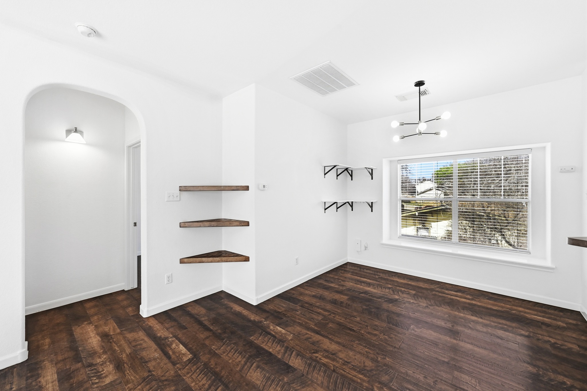 2821 Saville Loop, Unit 21C Austin, TX 78741 - Photo 14 of 31 The dining area sits right by the windows, making it a great spot for a morning coffee or a casual dinner while keeping you in the mix of the second-floor layout