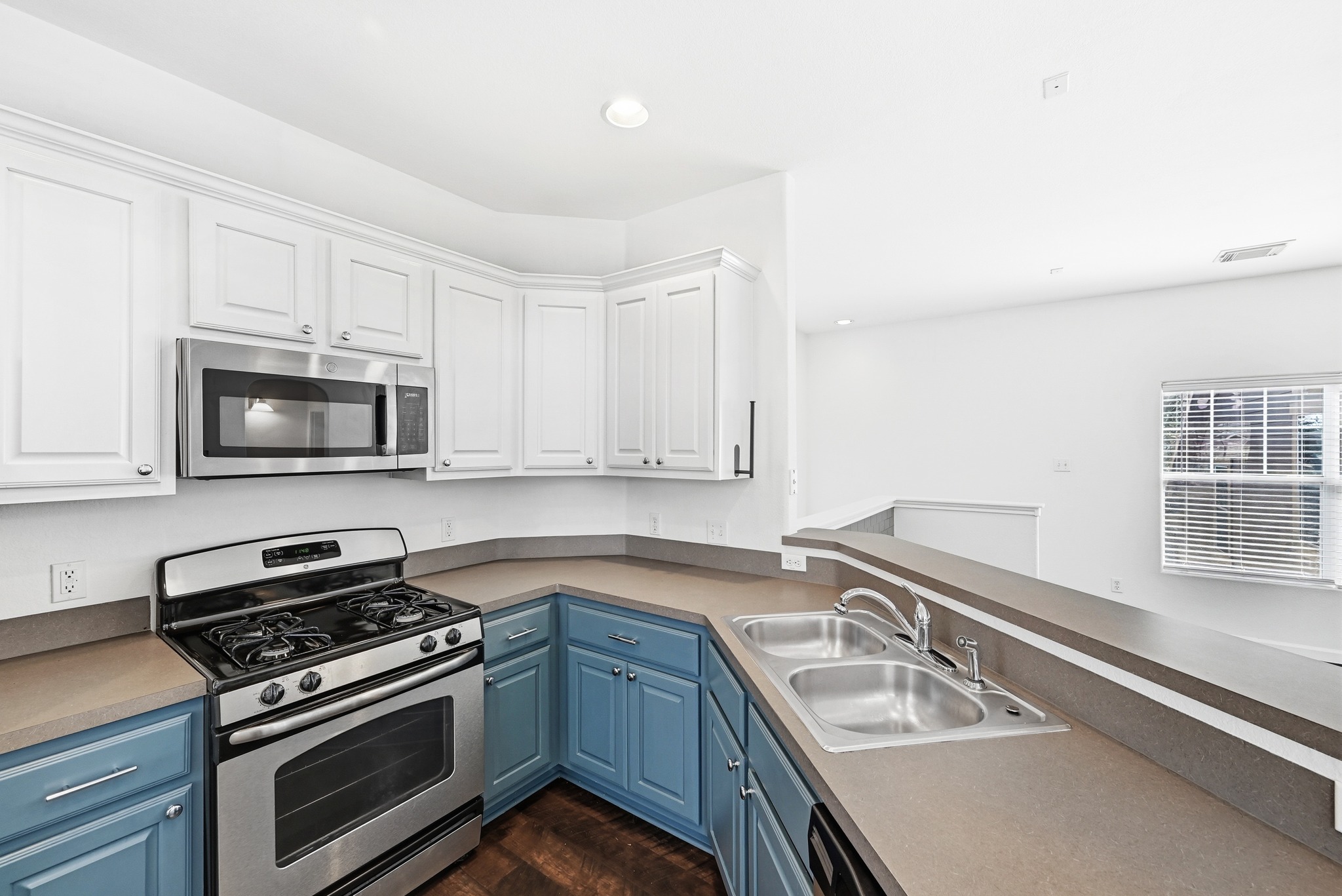 2821 Saville Loop, Unit 21C Austin, TX 78741 - Photo 18 of 31 Natural light from the second-floor windows reaches all the way into the kitchen, keeping the cooking area bright throughout the day