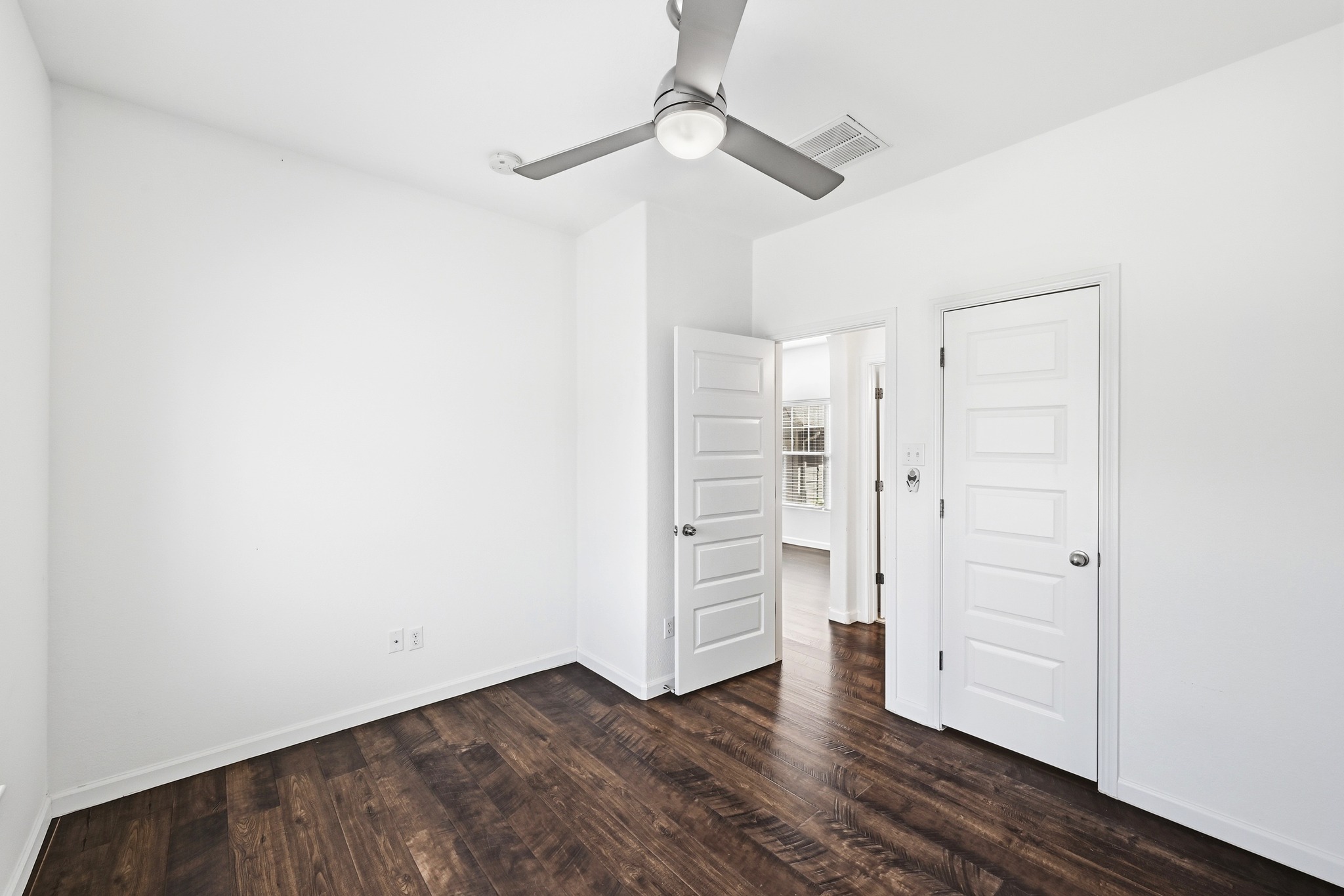 2821 Saville Loop, Unit 21C Austin, TX 78741 - Photo 23 of 31 Tucked away from the main living area, the bedroom offers a private spot to unwind at the end of the day