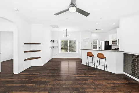 a view of kitchen with furniture and wooden floor
