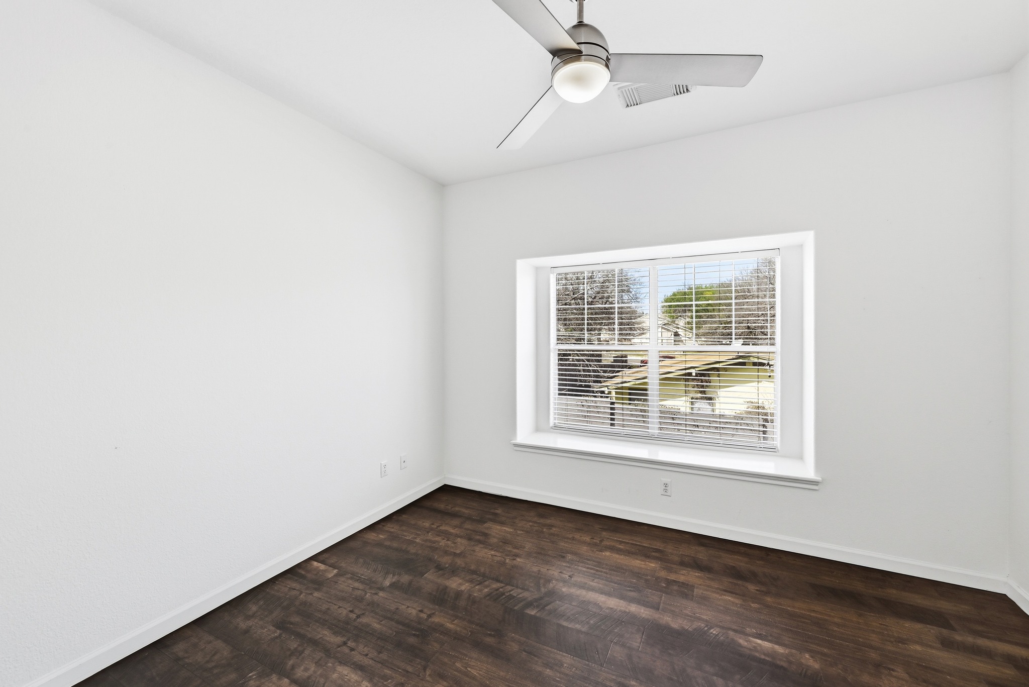 2821 Saville Loop, Unit 21C Austin, TX 78741 - Photo 4 of 31 The bedroom is large enough to fit a full furniture suite comfortably, with large windows that let in plenty of morning light