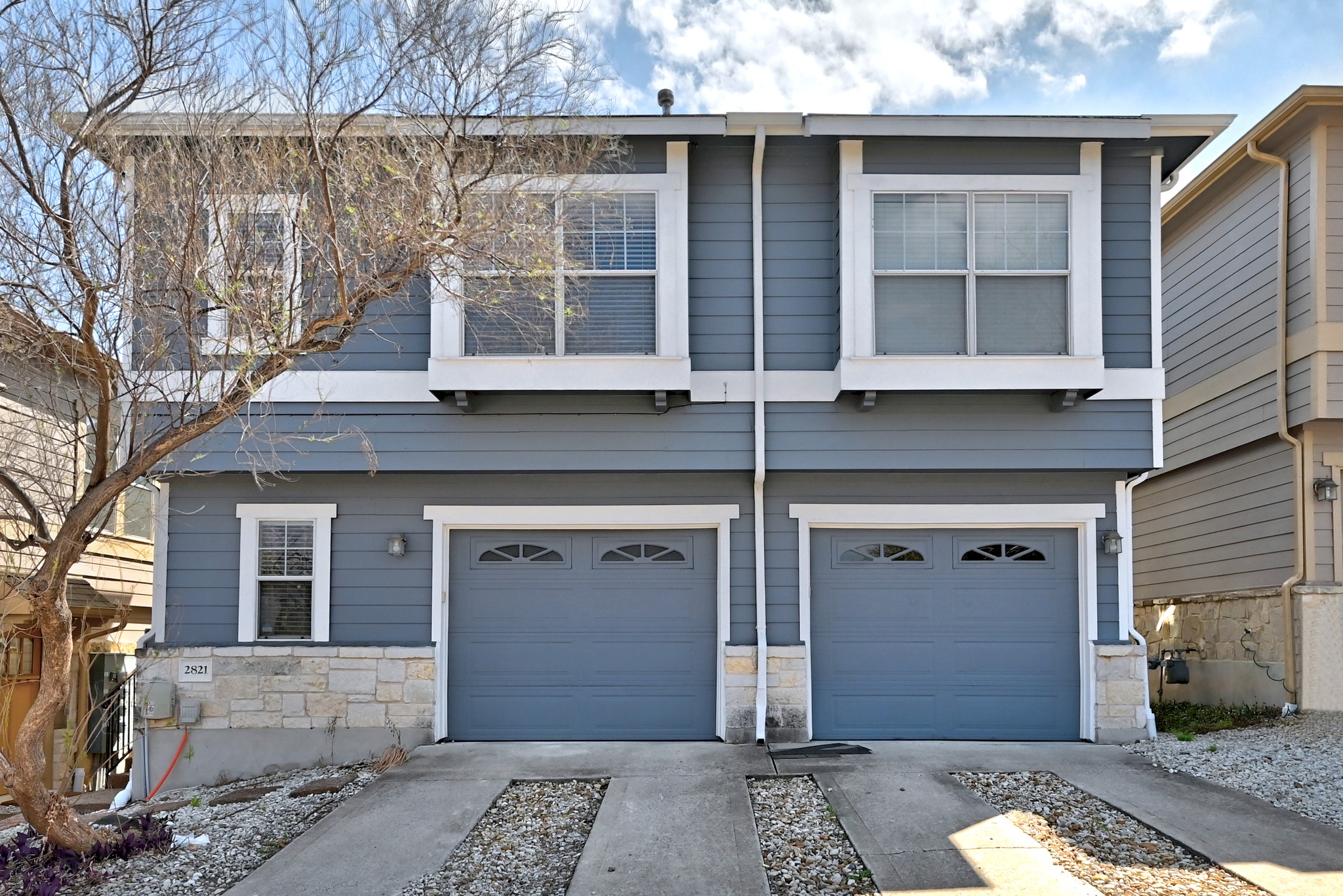 2821 Saville Loop, Unit 21C Austin, TX 78741 - Photo 7 of 31 A private 1-car garage provides internal access to the foyer, while the full-length driveway offers a rare second parking spot for guests within the gated Edgewick community