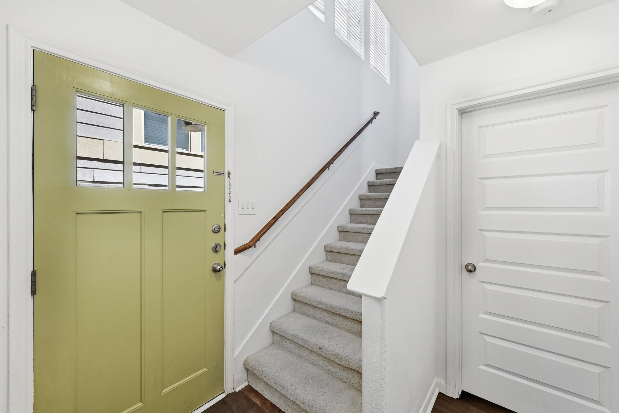 2821 Saville Loop, Unit 21C Austin, TX 78741 - Photo 10 of 31 The dedicated foyer on the ground floor serves as a practical landing zone with easy access to the private garage and stairs leading to the main living areas