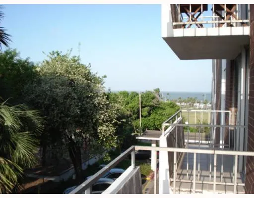a view of a balcony with furniture