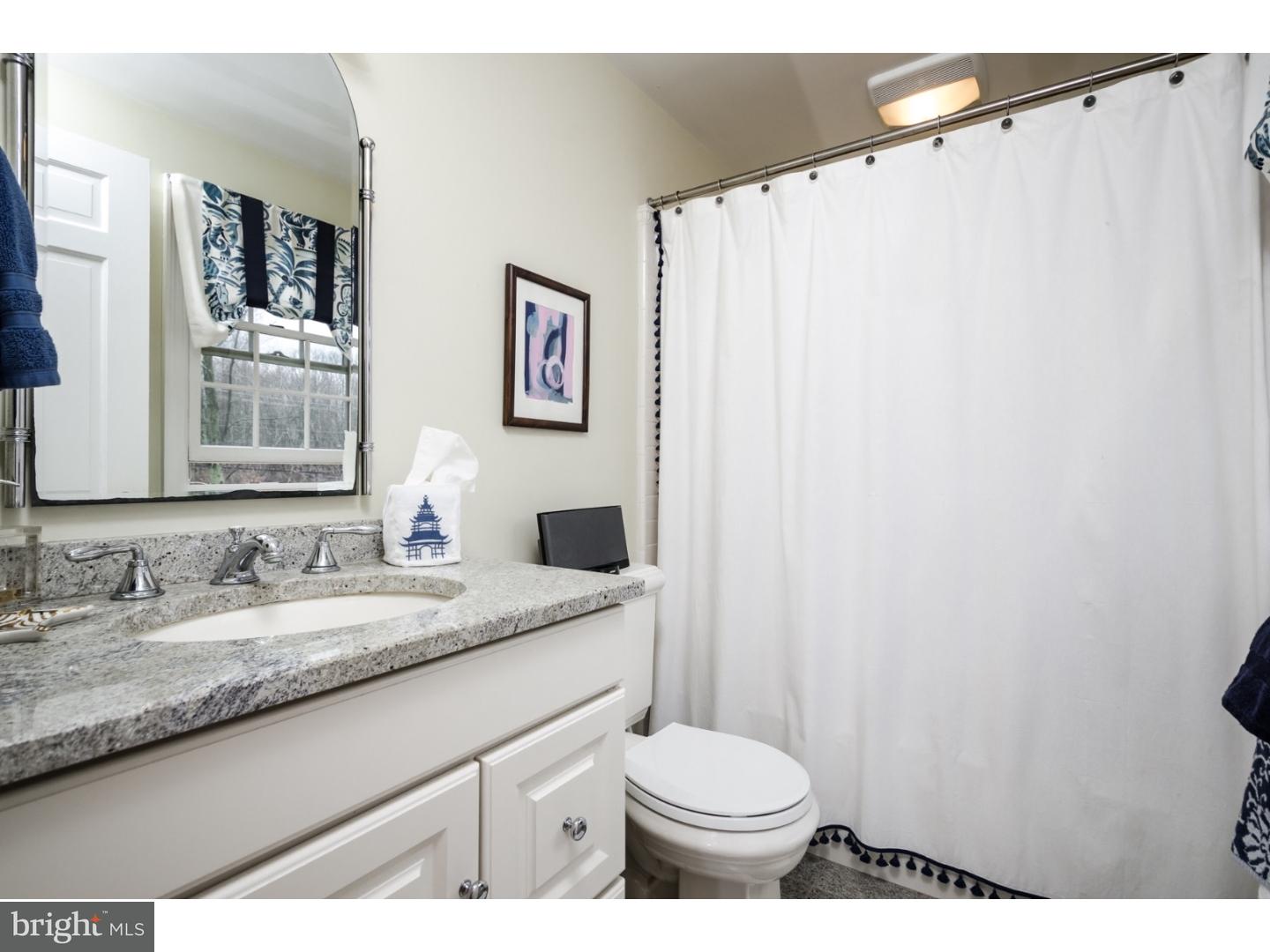 78 Bayberry Road Princeton, NJ 08540 - Photo 12 of 25 a bathroom with a granite countertop sink and a mirror