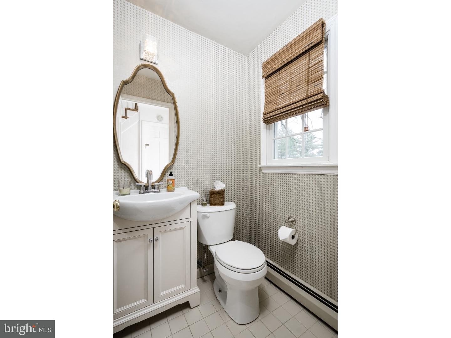 78 Bayberry Road Princeton, NJ 08540 - Photo 21 of 25 a bathroom with a toilet a sink and a mirror
