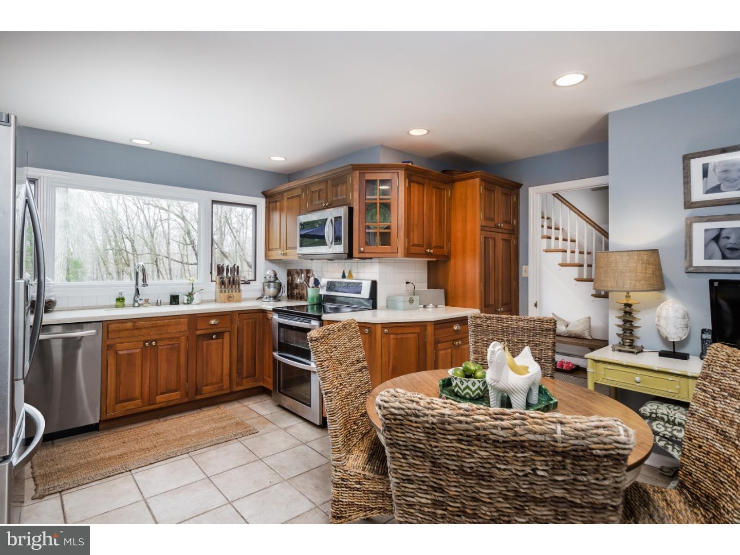 78 Bayberry Road Princeton, NJ 08540 - Photo 6 of 25 a living room with furniture a kitchen view and a large window