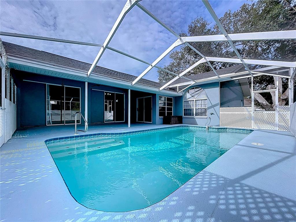 18812 Bascomb Lane Hudson, FL 34667 - Photo 53 of 57 a view of a house with a backyard