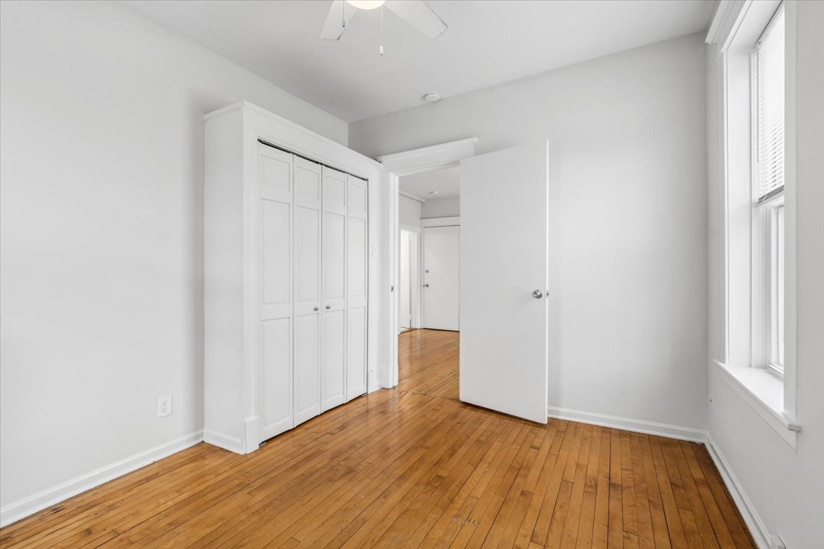 5414 North Broadway, Unit 2 Chicago, IL 60640 - Photo 12 of 18 a view of empty room with wooden floor