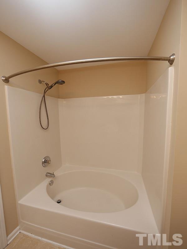 8341 City Loft Court Raleigh, NC 27613 - Photo 13 of 19 a bathroom with a bath tub and a shower
