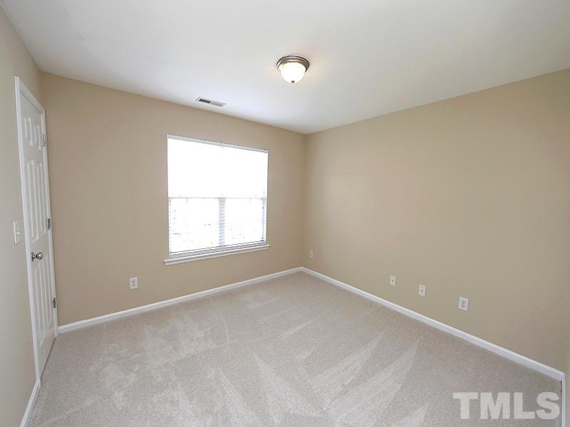 8341 City Loft Court Raleigh, NC 27613 - Photo 14 of 19 a view of an empty room with a window