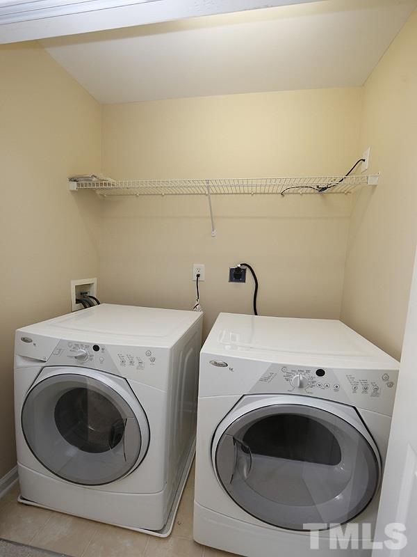 8341 City Loft Court Raleigh, NC 27613 - Photo 16 of 19 a utility room with dryer and washer
