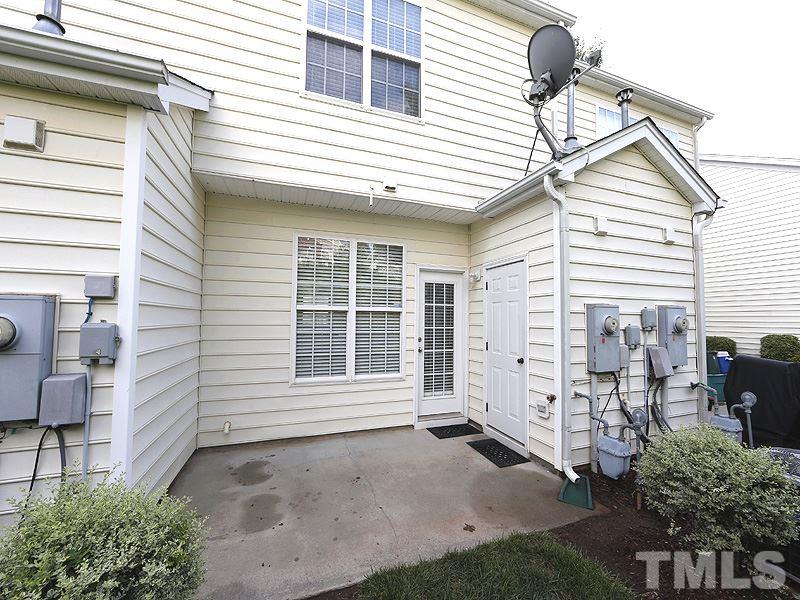 8341 City Loft Court Raleigh, NC 27613 - Photo 18 of 19 a front view of a house with a outdoor space