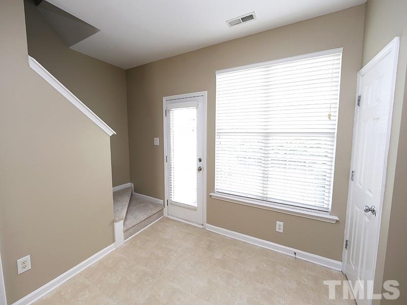 8341 City Loft Court Raleigh, NC 27613 - Photo 7 of 19 a view of an empty room with a window