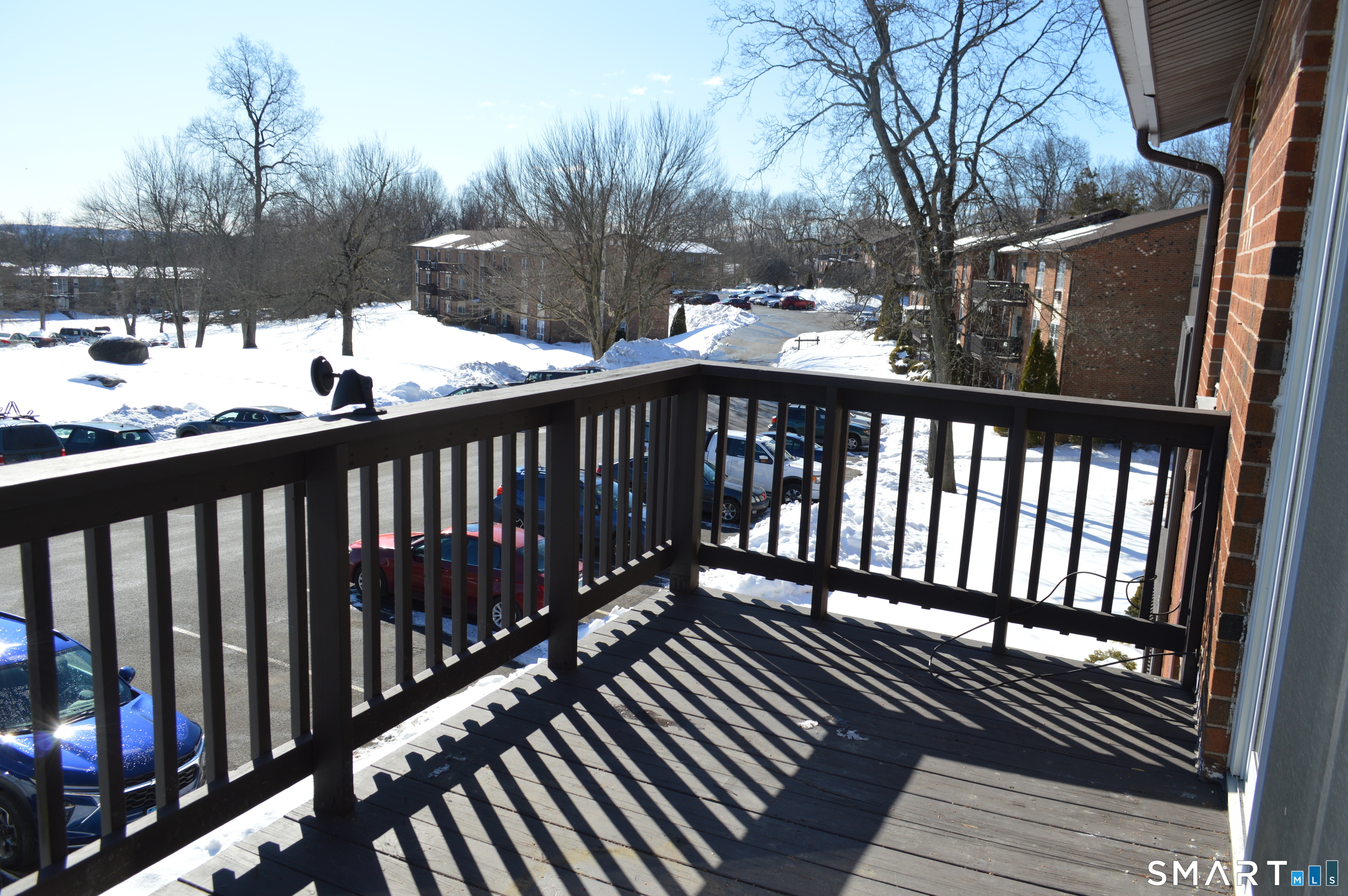 57 Balance Rock Road, Unit 17 Seymour, CT 06483 - Photo 16 of 18 a view of balcony with wooden floor and outdoor seating