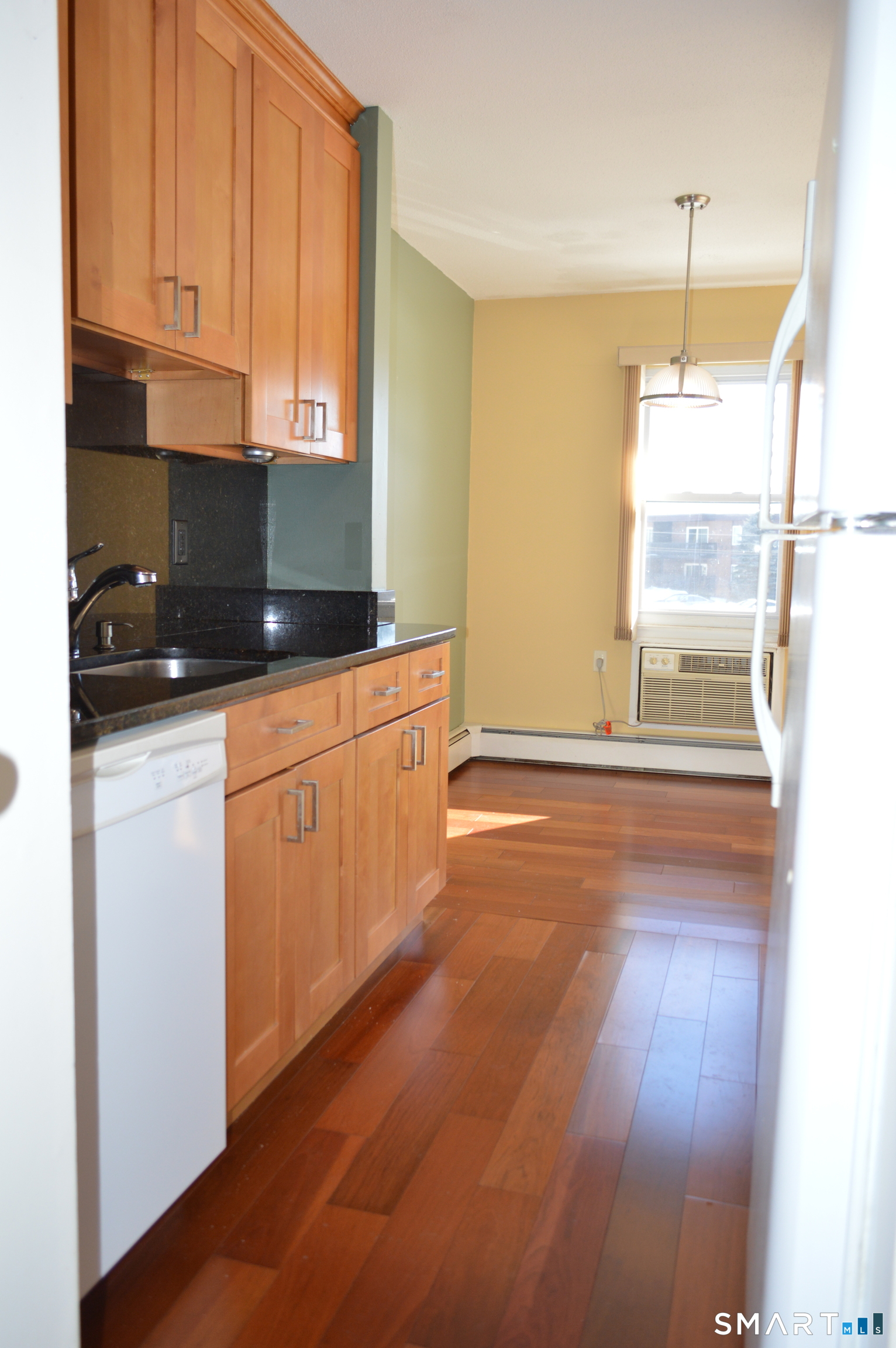 57 Balance Rock Road, Unit 17 Seymour, CT 06483 - Photo 4 of 18 a kitchen with granite countertop white cabinets and white appliances