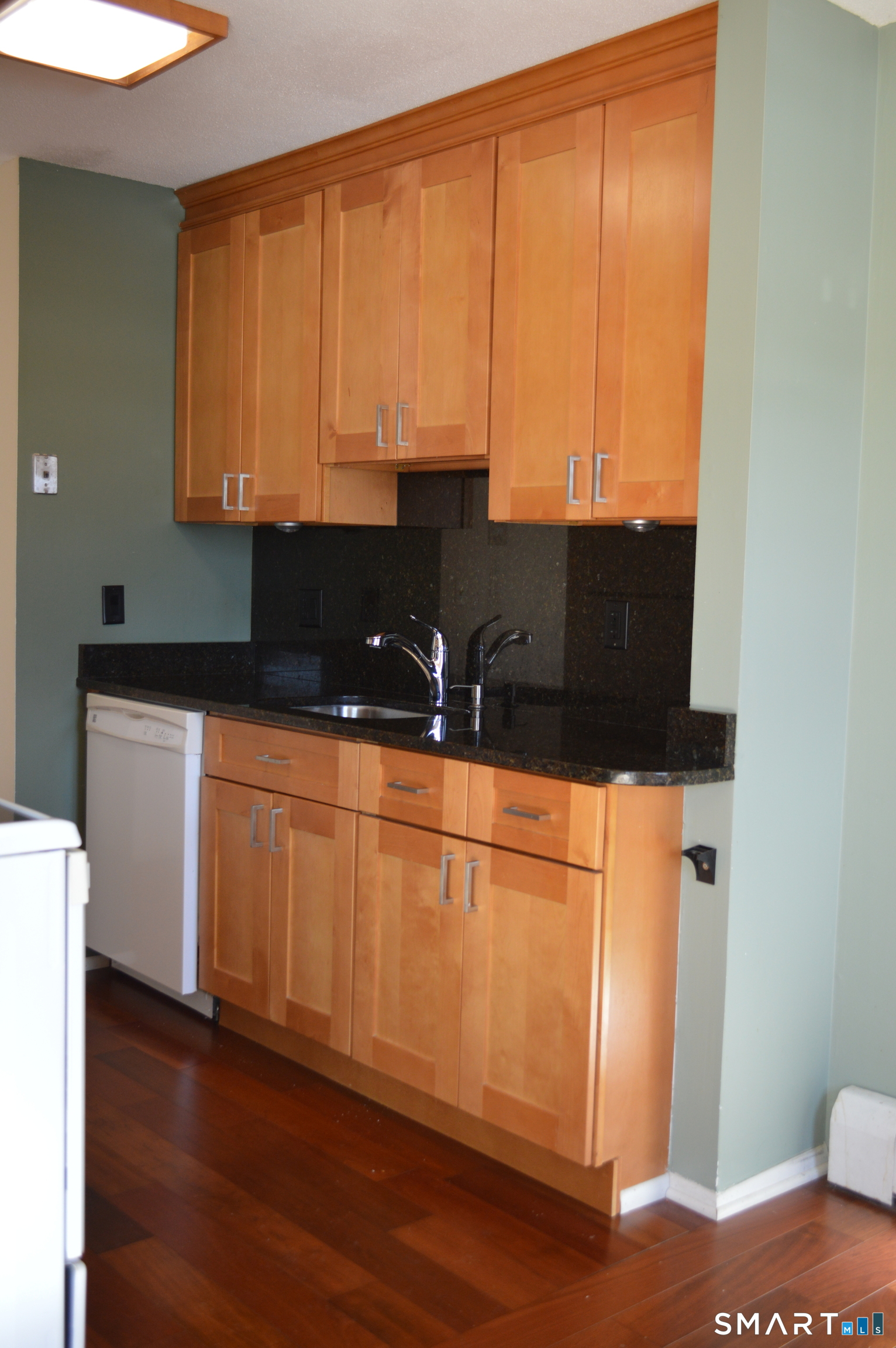 57 Balance Rock Road, Unit 17 Seymour, CT 06483 - Photo 5 of 18 a kitchen with stainless steel appliances wooden cabinets and a sink