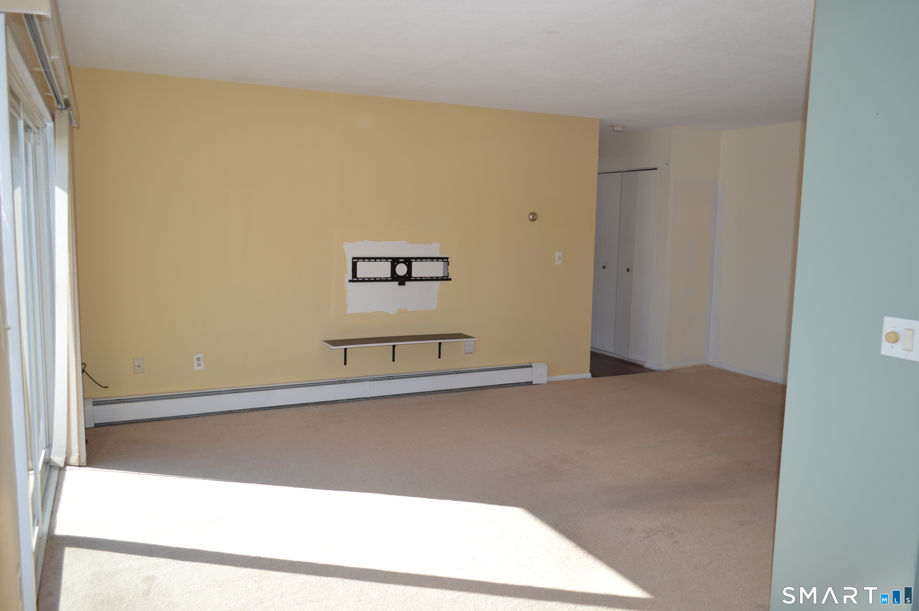 57 Balance Rock Road, Unit 17 Seymour, CT 06483 - Photo 8 of 18 a view of a hallway with an empty room