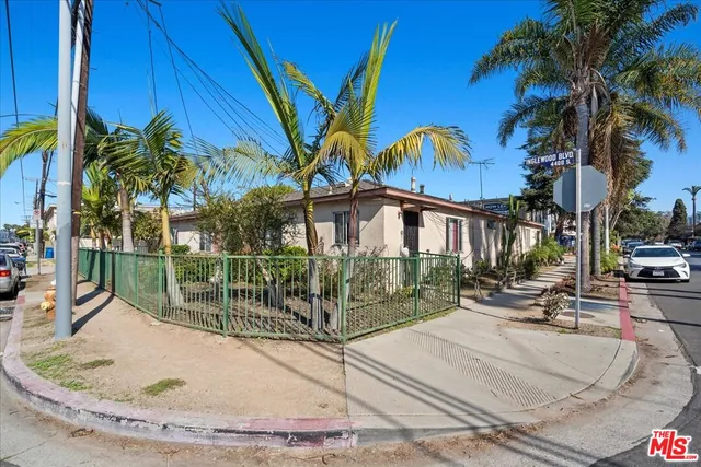 front view of a house with a garden