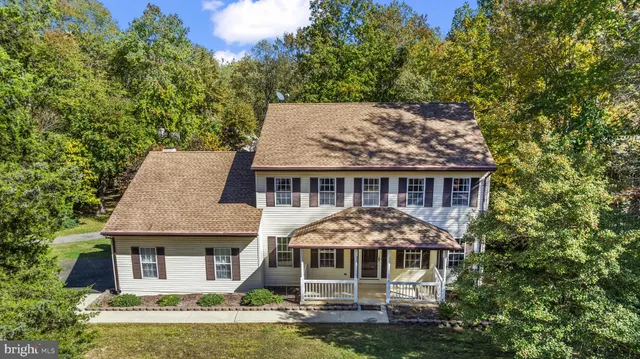 aerial view of a house with a garden