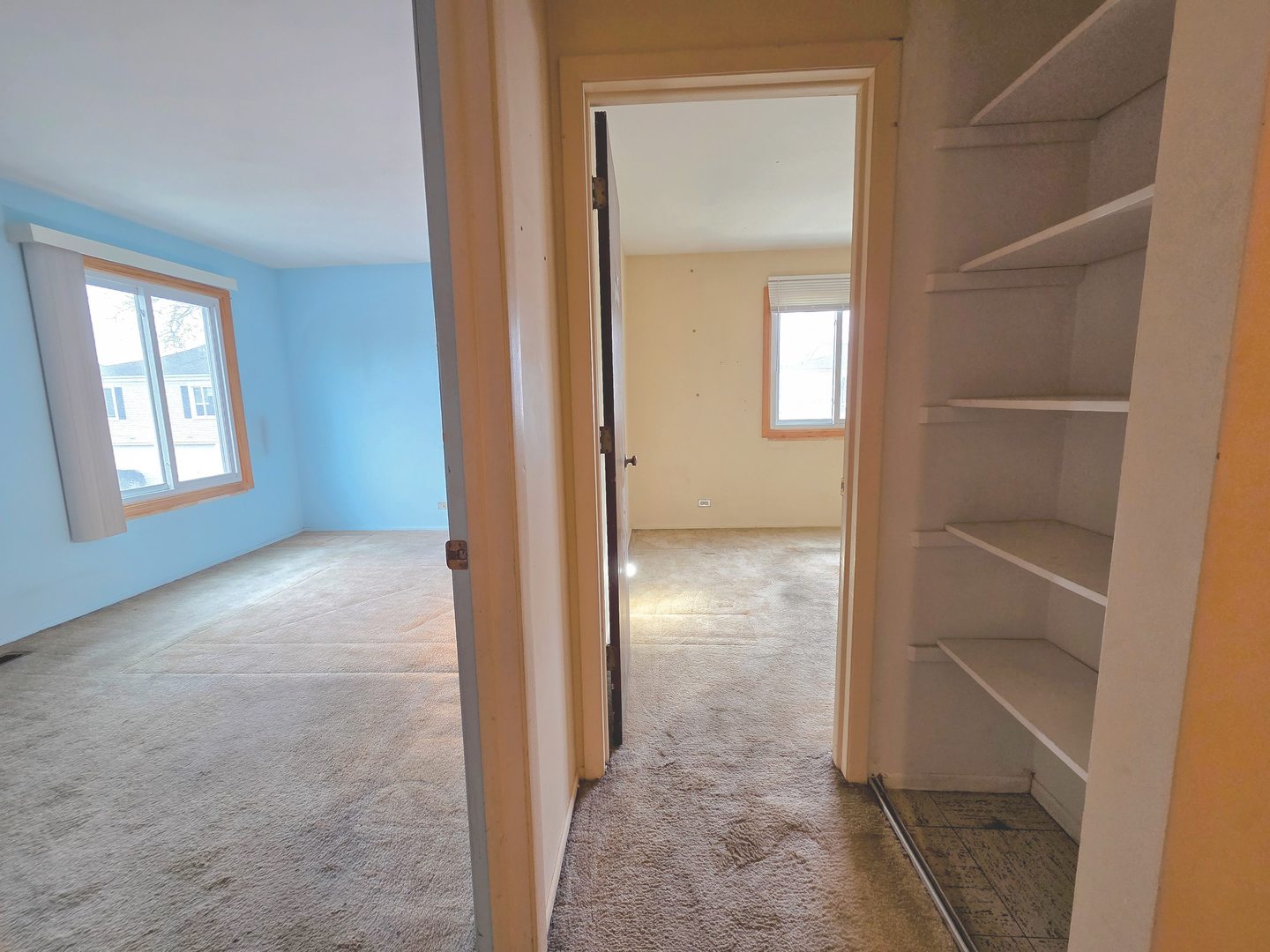 1481 Quaker Lane, Unit 117B Prospect Heights, IL 60070 - Photo 11 of 24 a view of hallway with closet and a window
