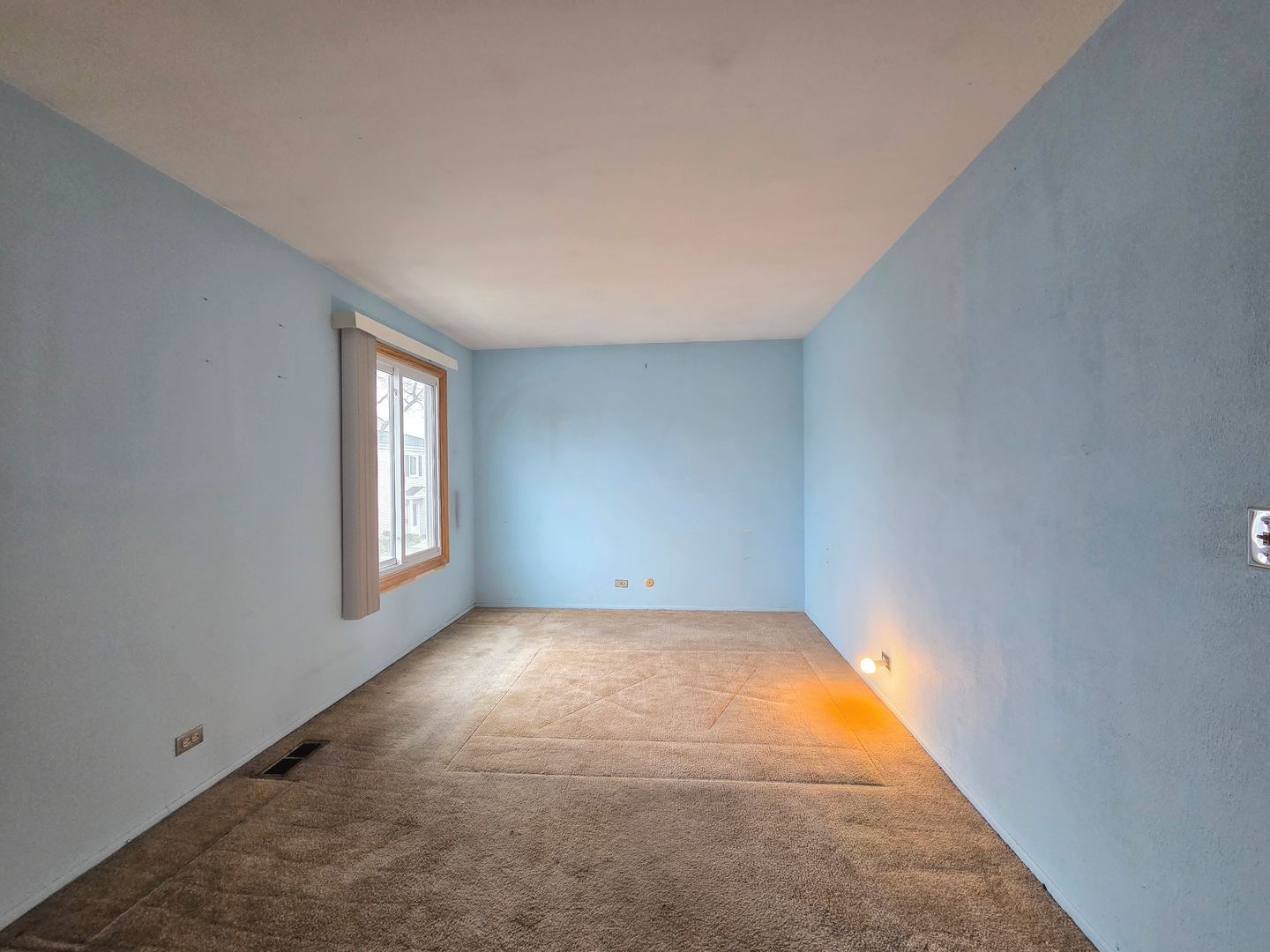 1481 Quaker Lane, Unit 117B Prospect Heights, IL 60070 - Photo 13 of 24 an empty room with windows
