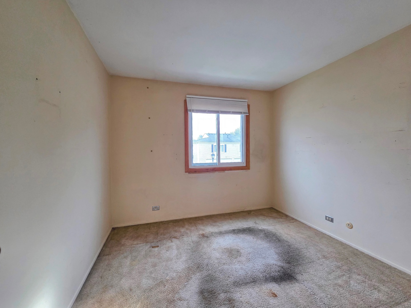 1481 Quaker Lane, Unit 117B Prospect Heights, IL 60070 - Photo 18 of 24 an empty room with a window
