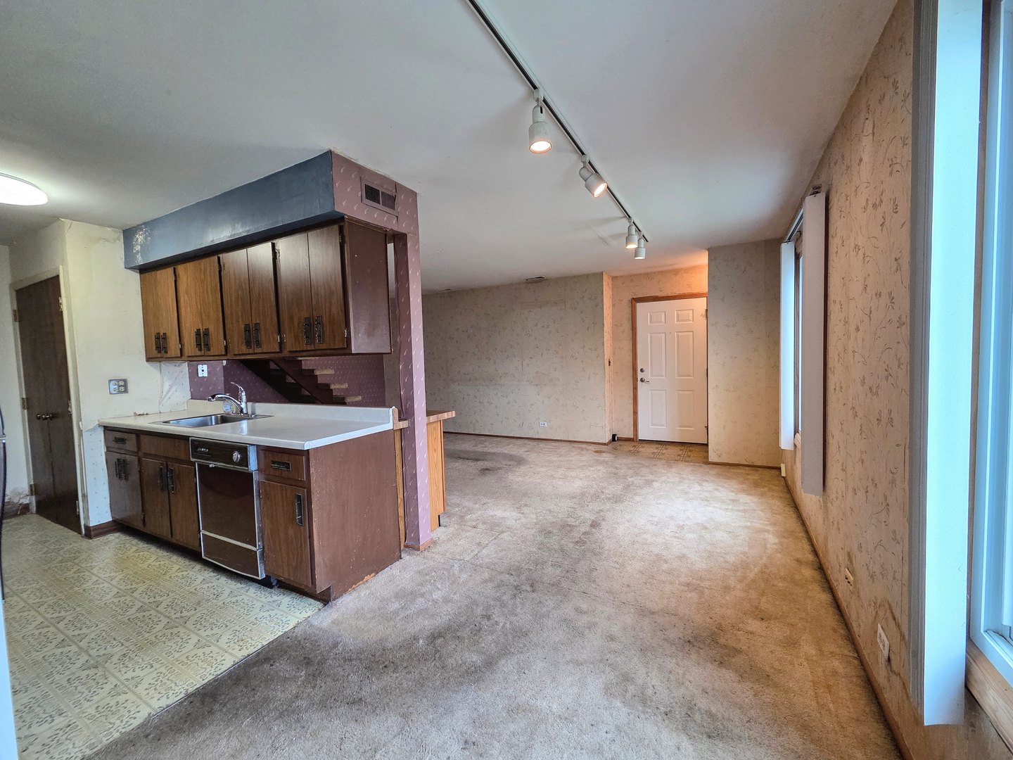 1481 Quaker Lane, Unit 117B Prospect Heights, IL 60070 - Photo 4 of 24 a view of cabinets and stainless steel appliances