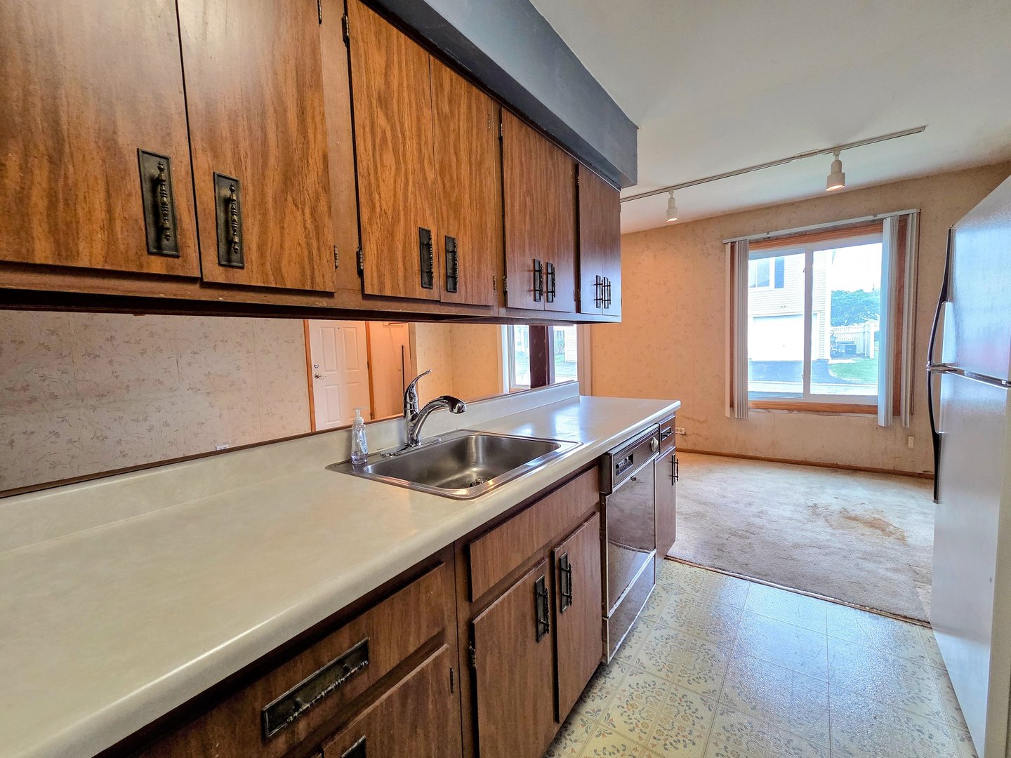 1481 Quaker Lane, Unit 117B Prospect Heights, IL 60070 - Photo 8 of 24 a kitchen with stainless steel appliances granite countertop a sink and a stove