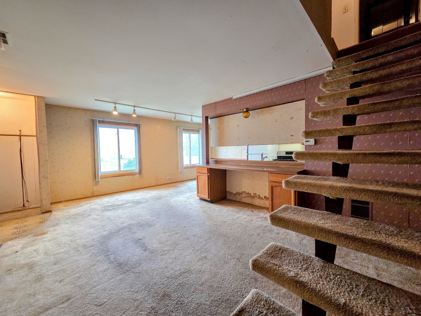 1481 Quaker Lane, Unit 117B Prospect Heights, IL 60070 - Photo 9 of 24 a view of a living room with furniture and a window