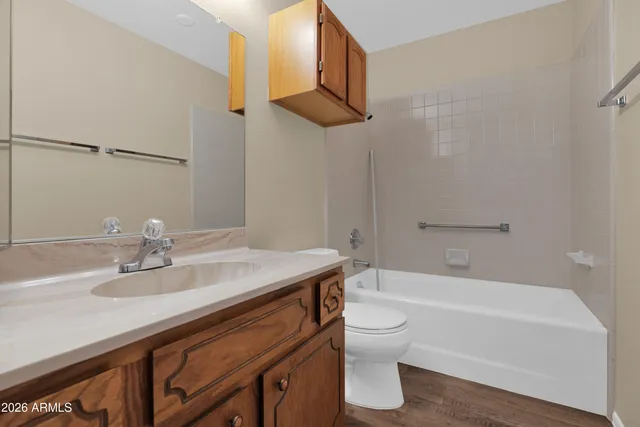 a bathroom with a sink a toilet and bathtub