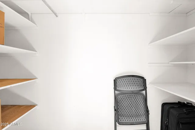 a room with a sink and a mirror