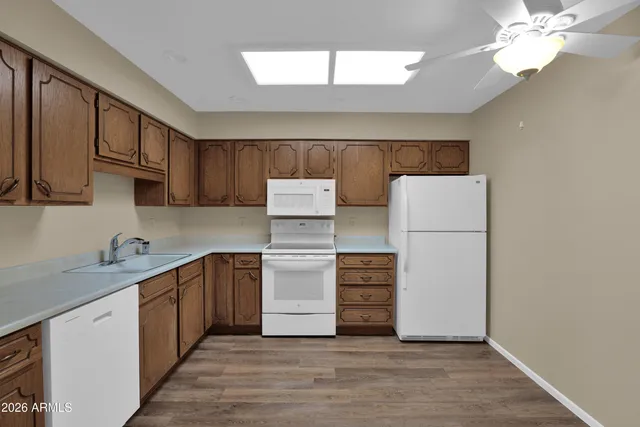 a kitchen with a refrigerator and a sink