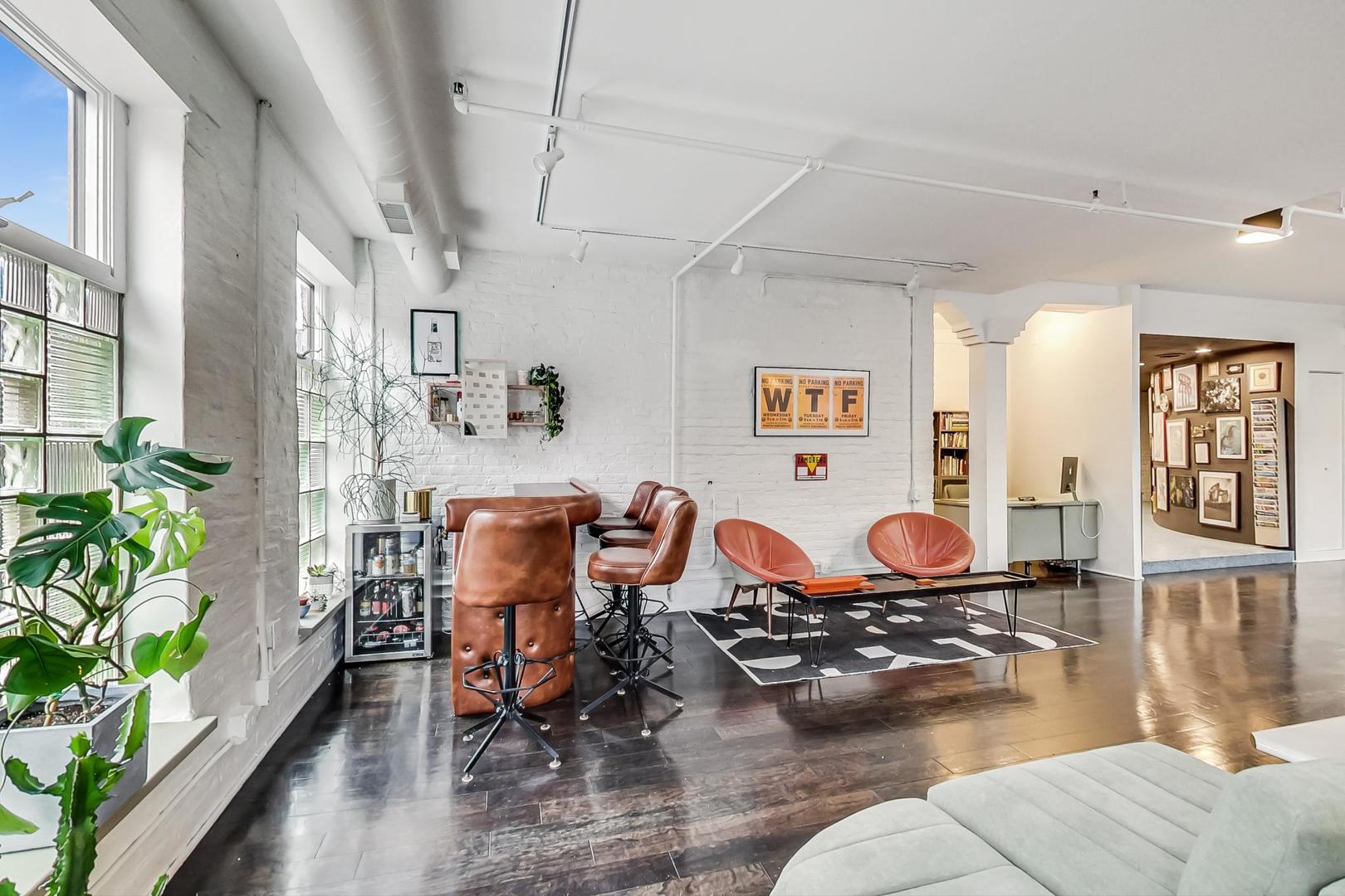1147 West Ohio Street, Unit 201 Chicago, IL 60642 - Photo 14 of 54 a living room with furniture