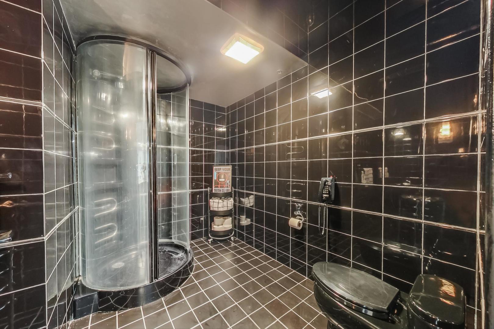 1147 West Ohio Street, Unit 201 Chicago, IL 60642 - Photo 28 of 54 a bathroom with a shower