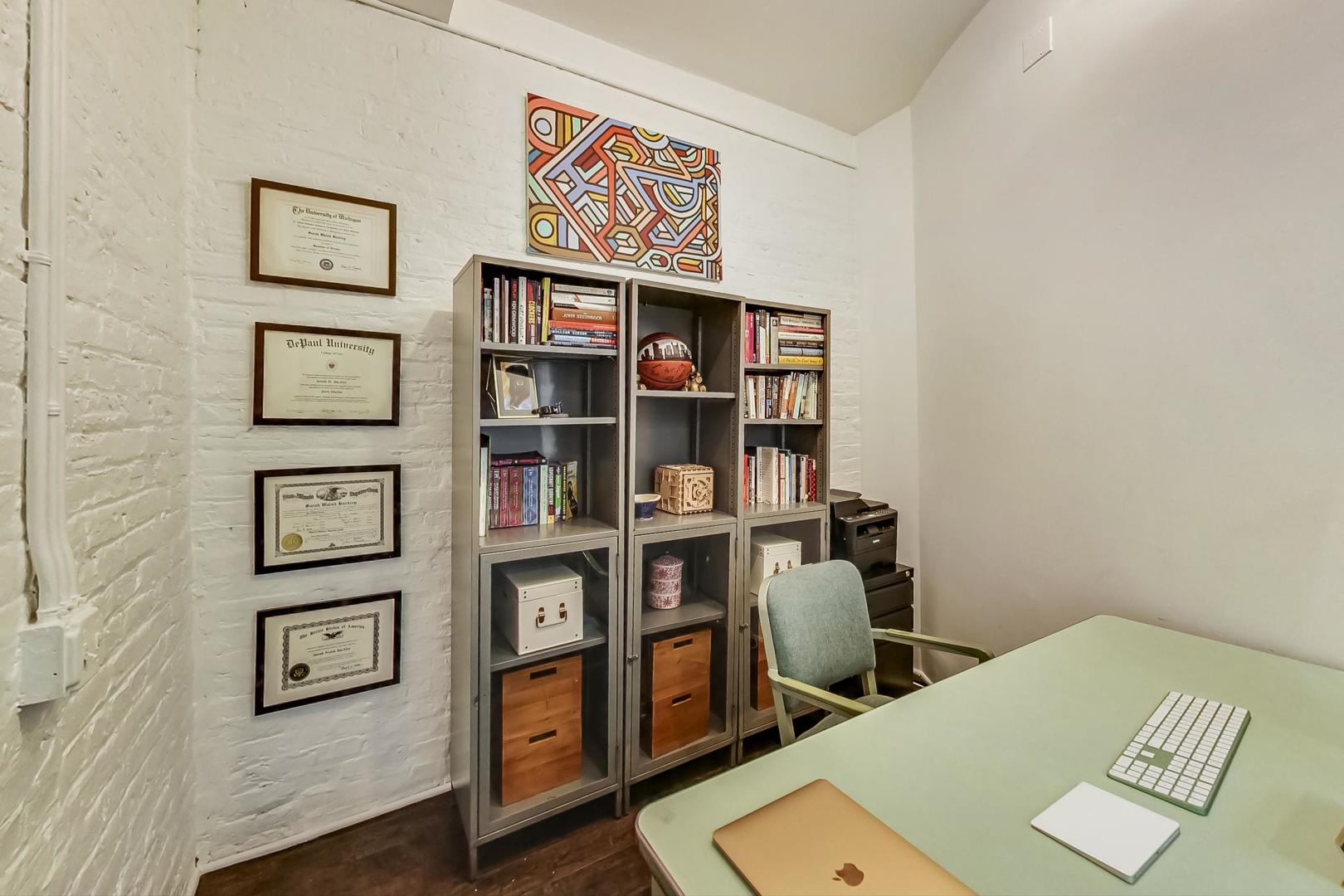 1147 West Ohio Street, Unit 201 Chicago, IL 60642 - Photo 34 of 54 a view of a workspace with furniture and cabinet