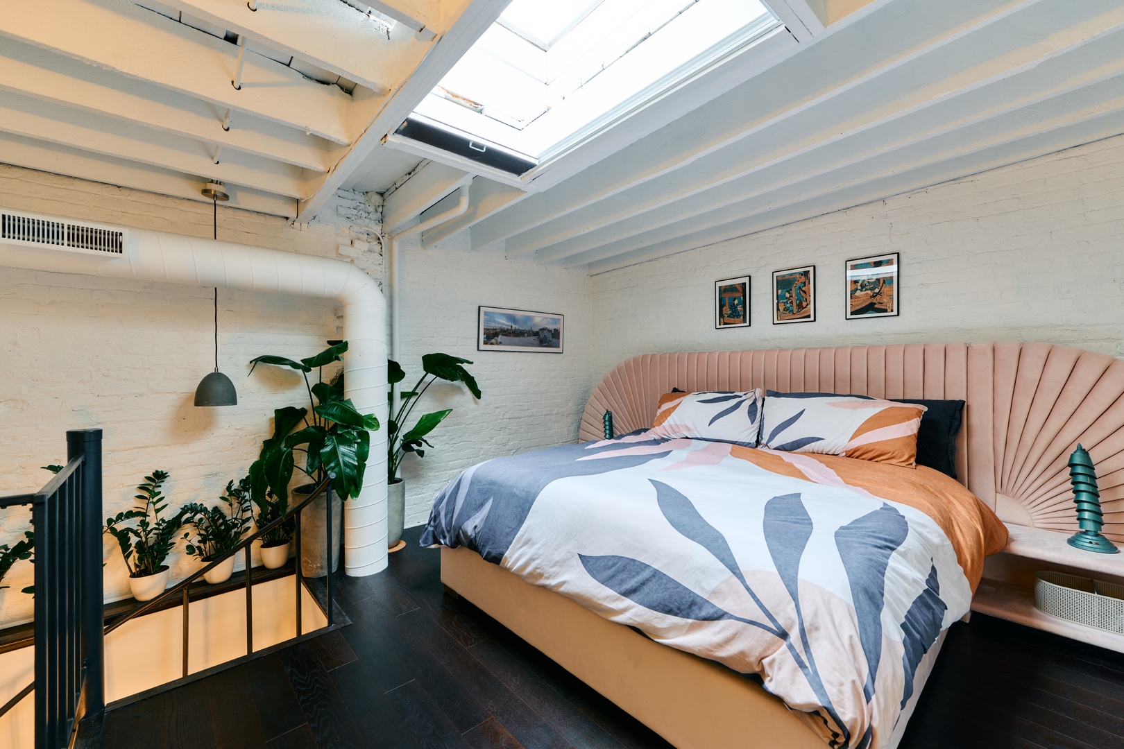 1147 West Ohio Street, Unit 201 Chicago, IL 60642 - Photo 35 of 54 a bedroom with bed and a potted plant