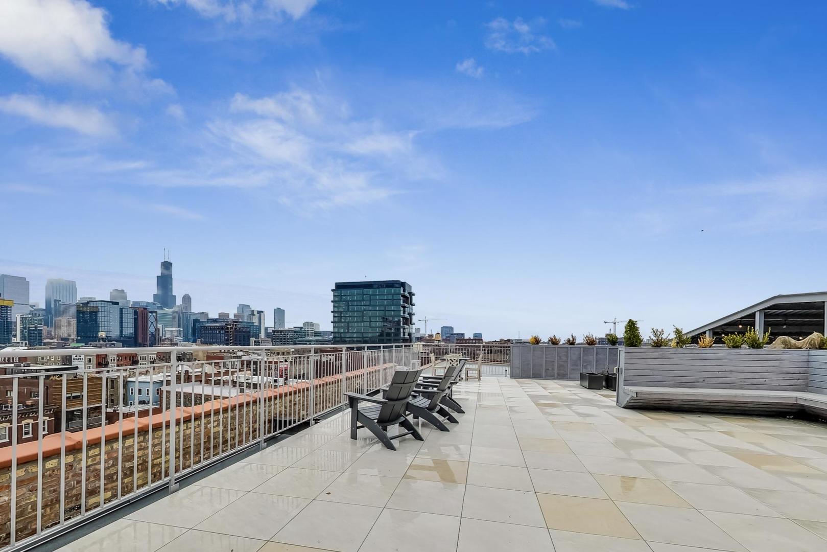 1147 West Ohio Street, Unit 201 Chicago, IL 60642 - Photo 50 of 54 a view of a terrace with sitting area